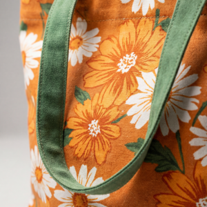 Custom canvas tote bag with orange daisy design